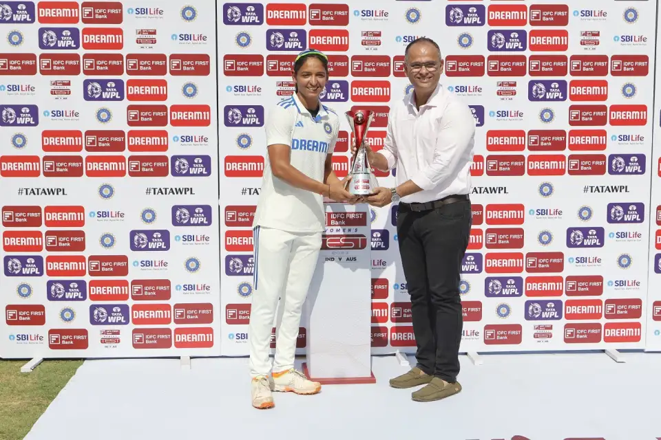 Harmanpreet Kaur collects the winner's trophy at the post-match presentation Harmanpreet Kaur collects the winner's trophy at the post-match presentation